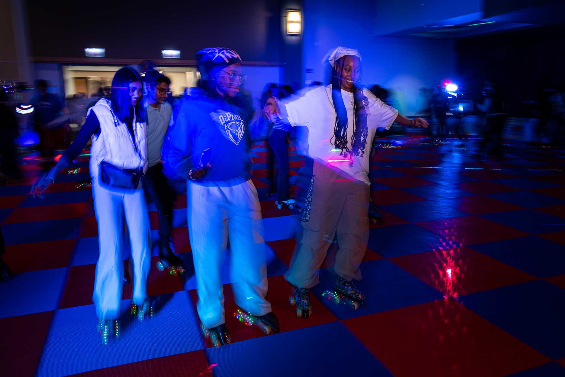 Before the night was over, students did their best to stay upright in a disco roller rink setup in Student Center 120AB. (Photo by Jeff Carrion / DePaul University) 